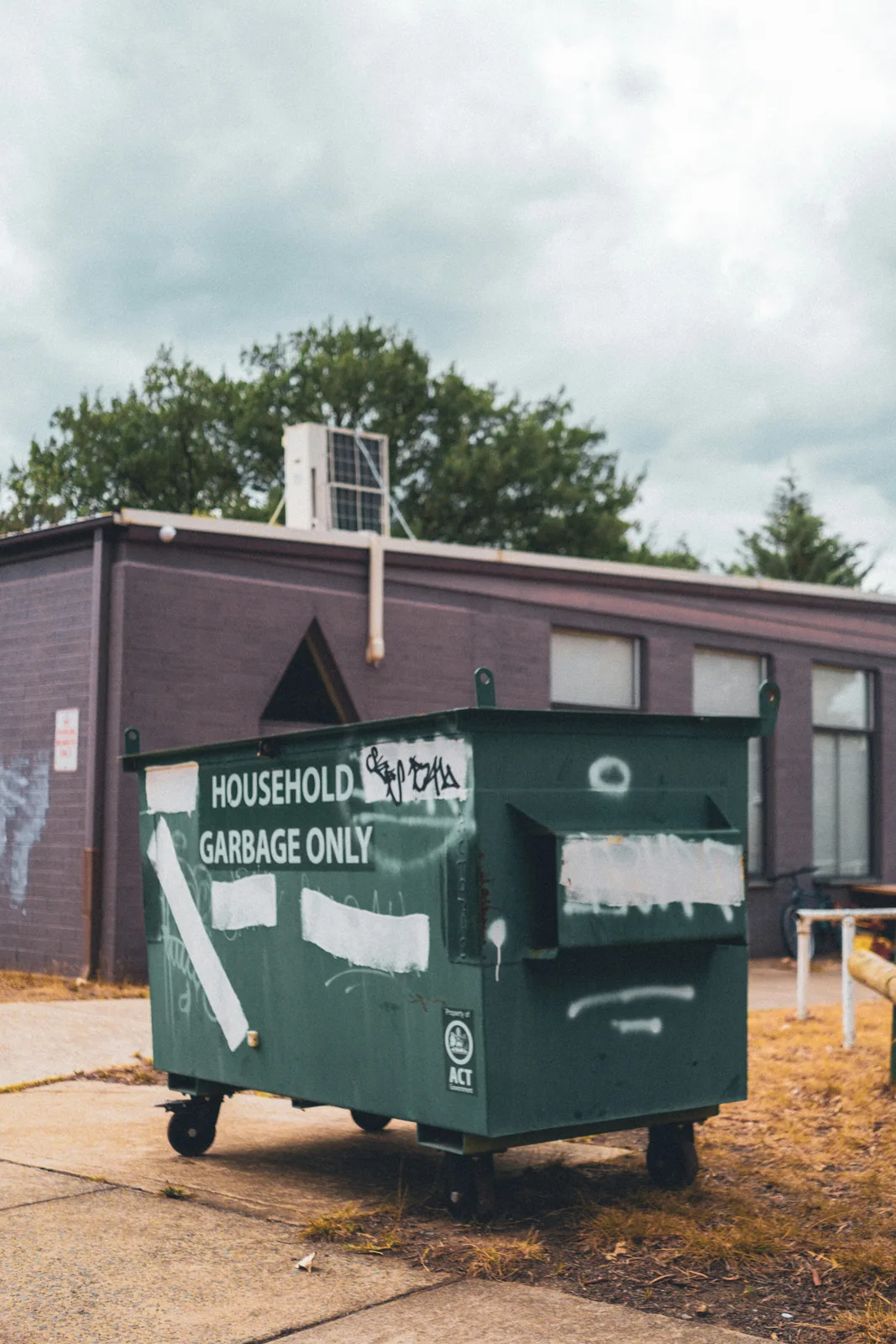 Household waste bagged in a front-load bin