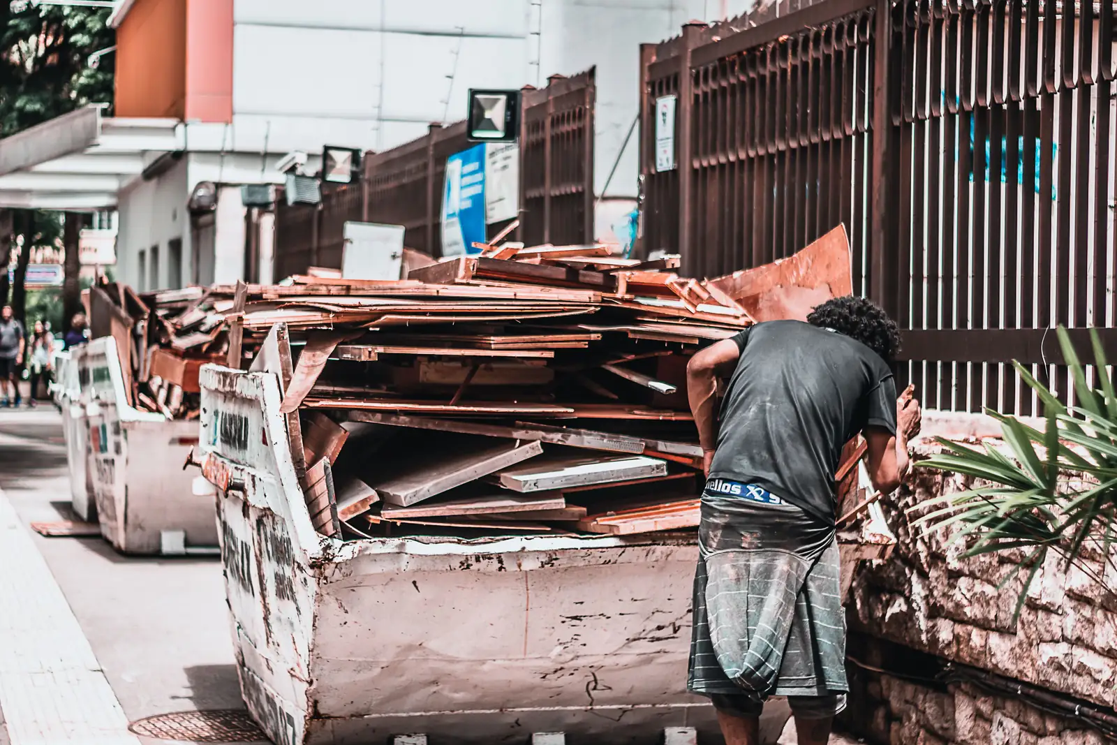 A street skip loaded with timber offcuts